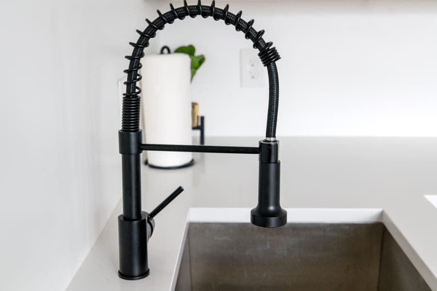 Commercial-style coil-spring kitchen faucet in stainless steel